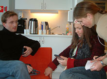 Geir, Camilla and Pernille are discussing use of handhelds